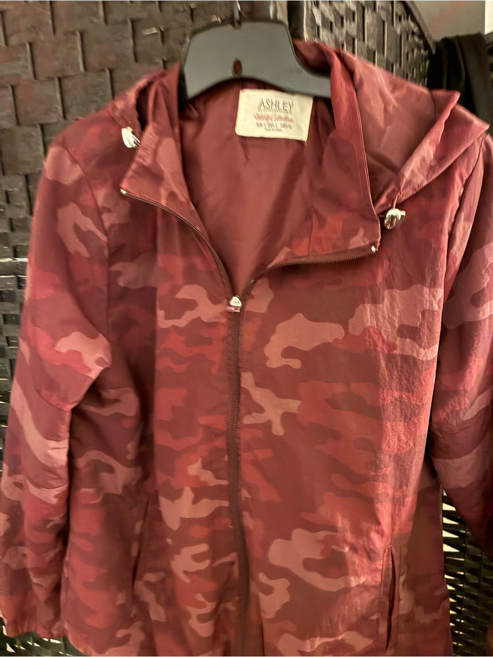 Woman’s burgundy camouflage windbreaker size Large